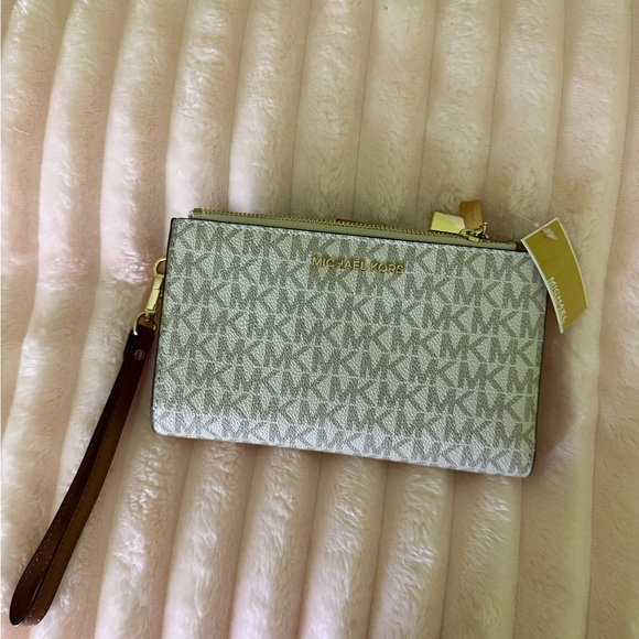 Michael Kors Handbags - Michael Kors Monogram Beige wristlet ( NEW)